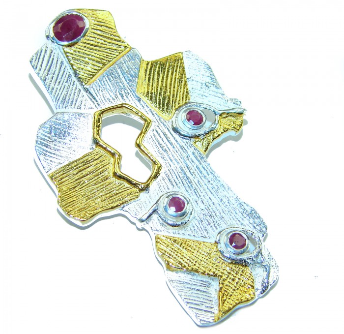 Holy Cross 1.2 carat Ruby 14K Gold over .925 Sterling Silver Pendant - Textured cross pendant with rubies and gold accents on silver, angled view.