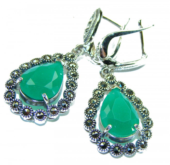 Stella - Very Unique authentic 12.5 carat Jade .925 Sterling Silver handcrafted earrings - Close-up of green jade earrings with ornate silver detailing.