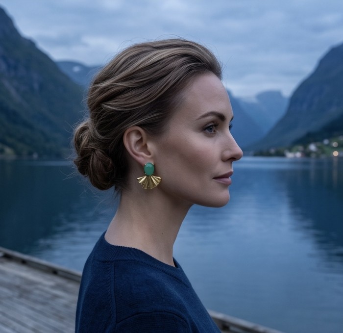 Unique genuine 8.5 carat Jade 18K Gold over over .925 Sterling Silver handcrafted earrings - Side view of jade and gold earrings worn by a person by a lake.