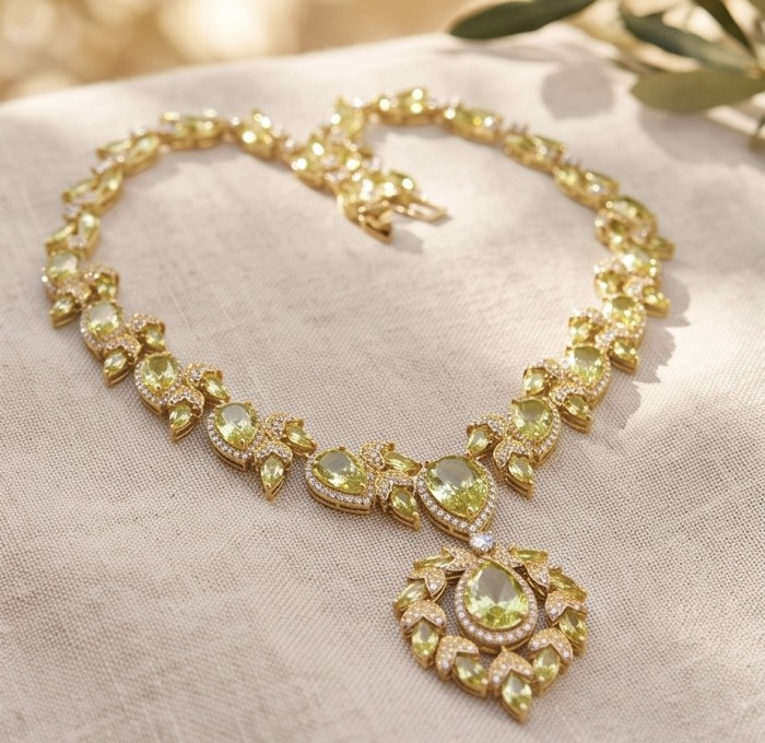 Serenade authentic 27.5 carat Brazilian Green Topaz 18K Gold over .925 Sterling Silver handcrafted necklace - Brazilian Green Topaz necklace, top view on fabric, 18K gold setting.
