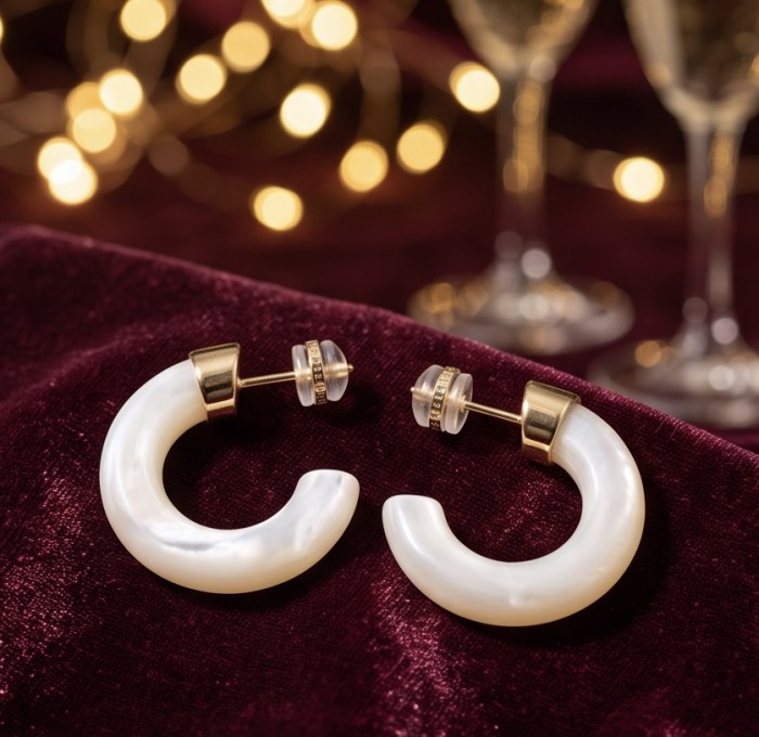 Top quality Sublime Blister Pearl 22K Gold over .925 Sterling Silver handcrafted Earrings - Elegant hoop earrings on velvet with blurred lights in background.