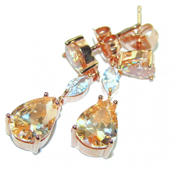 Luxurious Oval cut 7.5 carat Yellow Sapphire 18K Gold over .925 Sterling Silver handcrafted earrings - Close-up of luxurious yellow sapphire earrings in 18K gold.