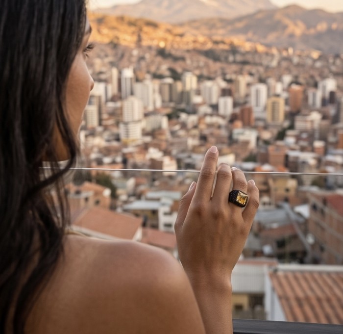 Solid 6.8 carat asscher Yellow Sapphire 4.5 carat pave black Sapphire 18K Gold over .925 Sterling Silver handcrafted ring size 9 - Woman wearing ring with 6.8 carat yellow sapphire, city view background