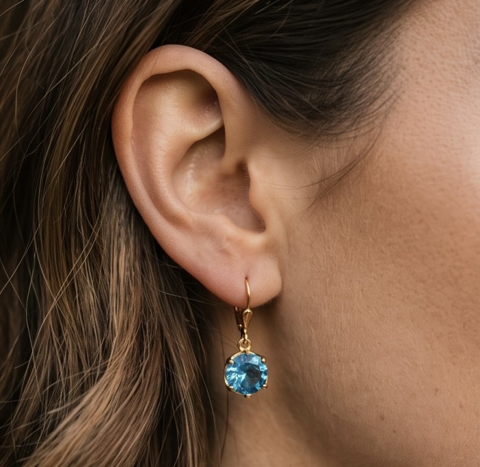 Deep Ocean 5.5 carat London Blue Topaz .925 Sterling Silver 18K Gold over handmade Statement earrings - Close-up of London Blue Topaz earring worn on ear