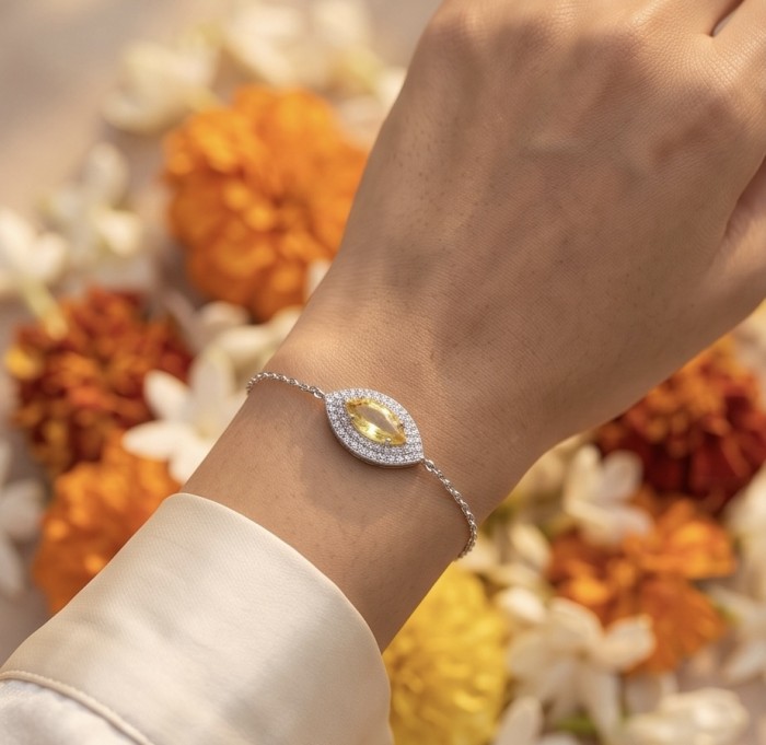 Luxurious 4.5 carat marquoise cut Yellow Sapphire .925 Sterling Silver handcrafted Statement Bracelet - Yellow Sapphire bracelet worn on hand with floral background.