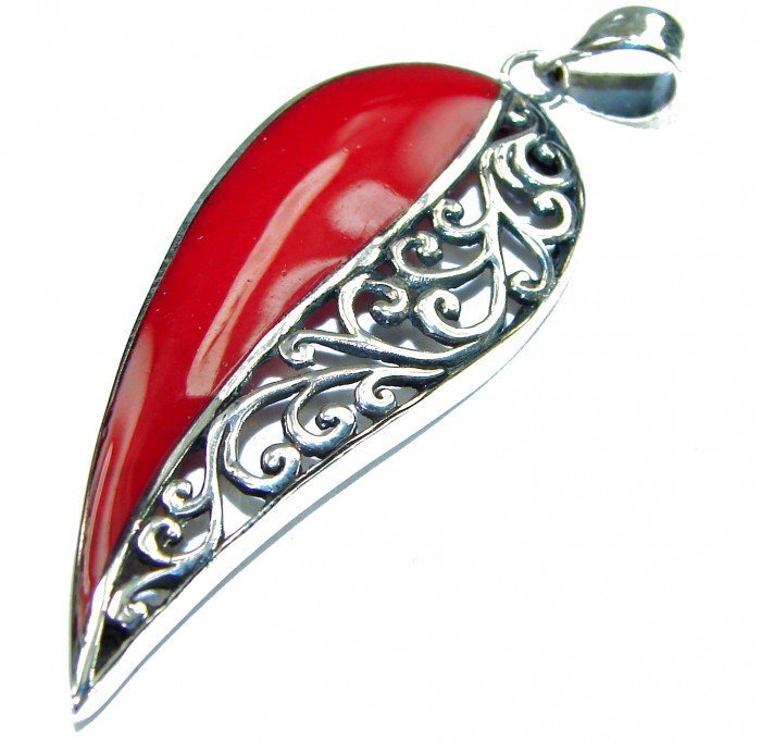 Real Coral .925 Sterling Silver Pendant - Side view of real coral sterling silver pendant with ornate detailing
