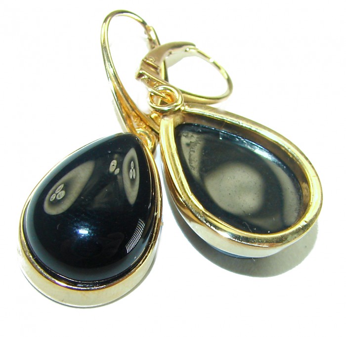 Outstanding authentic Onyx 14K Gold over .925 Sterling Silver Earrings - Close-up of teardrop onyx earrings with gold framing.