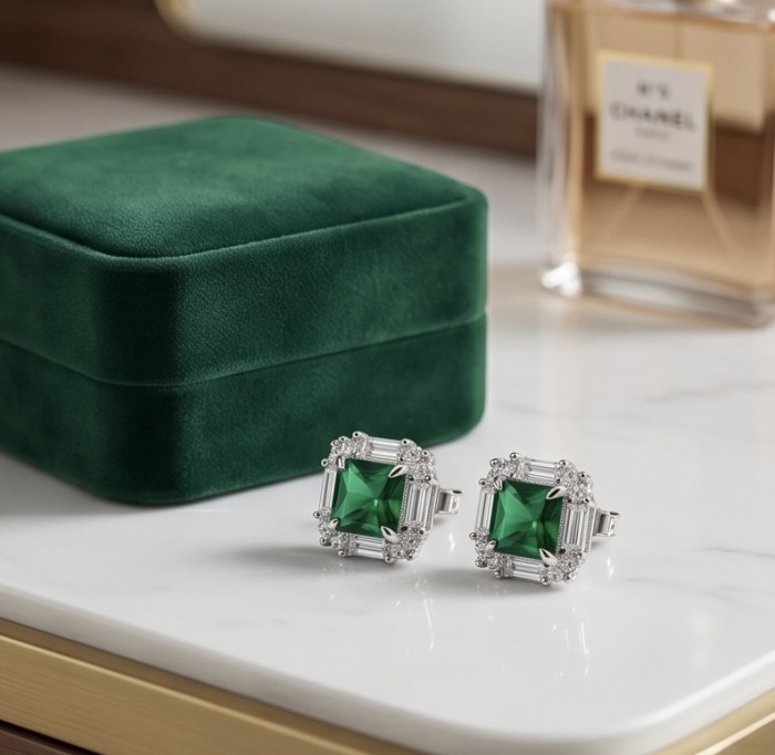 Art deco - assher cut 3.8 carat COLOMBIAN Emerald .925 Sterling Silver handmade Earrings - Emerald earrings with velvet box on marble surface, front view.