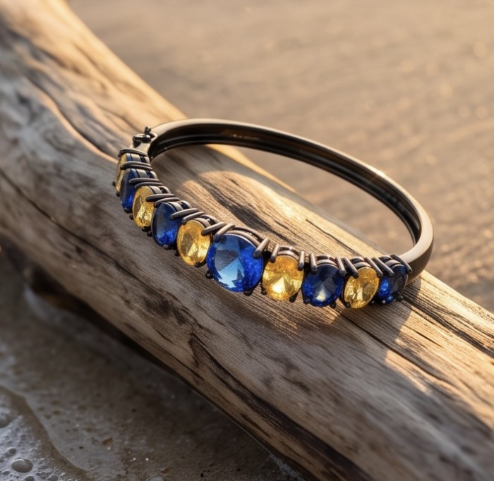 7.8 carat yellow Sapphire 9.2 carat Sapphire black rhodium over over .925 Sterling Silver handmade bangle Bracelet - Side view of bracelet with yellow and blue sapphires on black rhodium.