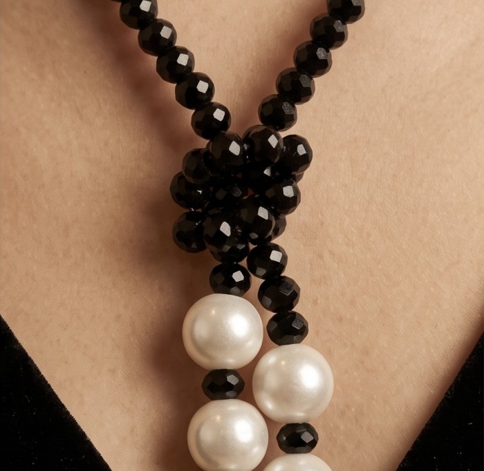 RETRO STYLE Authentic Onyx Mother of Pearl .925 Sterling Silver handcrafted necklace 44 inches - Close-up of black onyx and pearl necklace knot on skin
