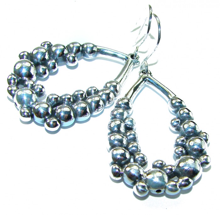 Fancy .925 Sterling Silver Italy made Earrings - Close-up of fancy .925 sterling silver Italy-made earrings