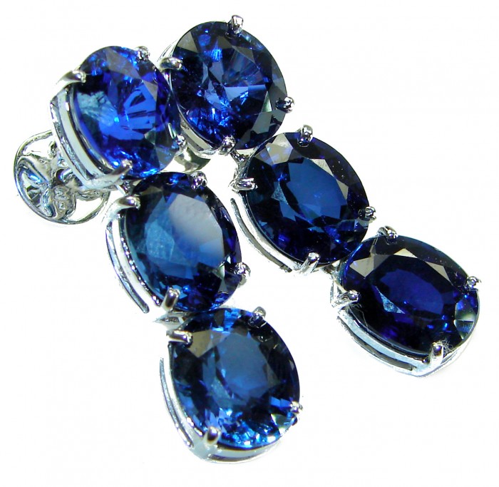 Deep Ocean 22.5 carat London Blue Topaz .925 Sterling Silver handmade Statement earrings - Close-up of Deep Ocean Blue Topaz earrings in sterling silver settings.