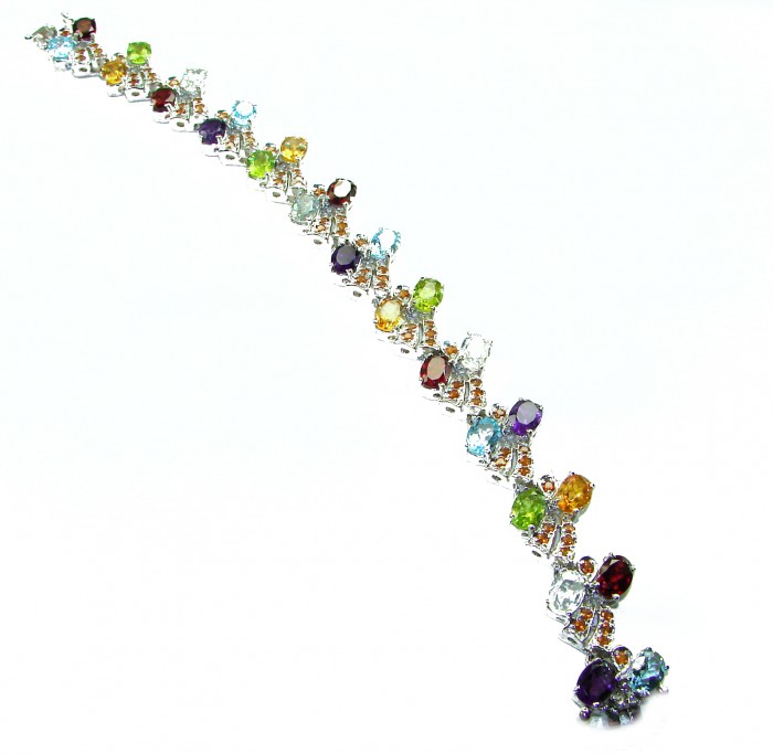 One of the kind 48.5 carat genuine Multigem Rhodium over .925 Sterling Silver Bracelet - Colorful multi-gem bracelet, angled view showcasing varied gemstones.