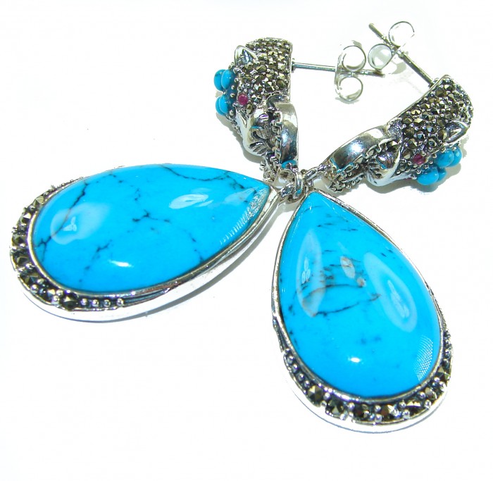 Great authentic Sleeping Beauty Turquoise .925 Sterling Silver handcrafted STATEMENT Earrings - Close-up of blue teardrop earrings with turquoise stones and silver detailing