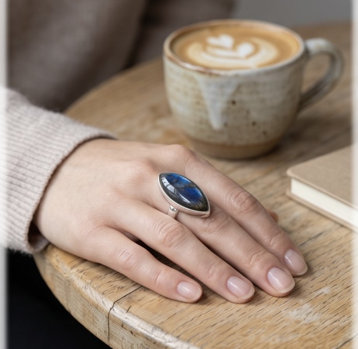 Shimmering Natural Labradorite .925 Sterling Silver handcrafted Large ring size 8 adjustable - Labradorite silver ring worn on hand, with coffee cup in background.