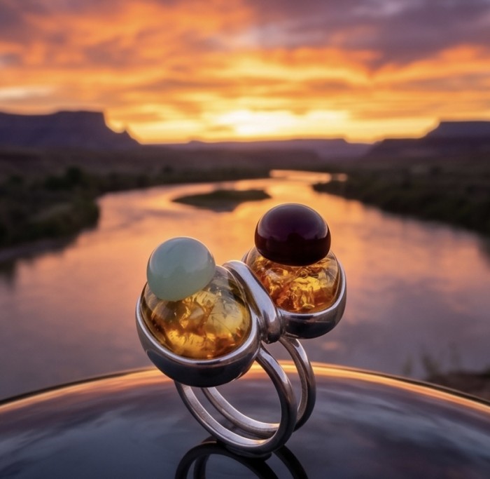 Perfect Harmony - Unique design Authentic Baltic Amber .925 Sterling Silver handcrafted ring; s. 7 adjustable - Close-up of Perfect Harmony rings with Baltic amber at sunset backdrop