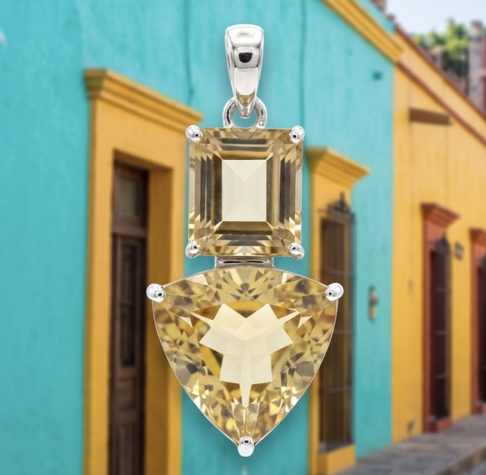 Vivien - Natural 17.2 carat Citrine .925 Sterling Silver dipped in Rhodium handmade pendant - Citrine pendant close-up against colorful building background.