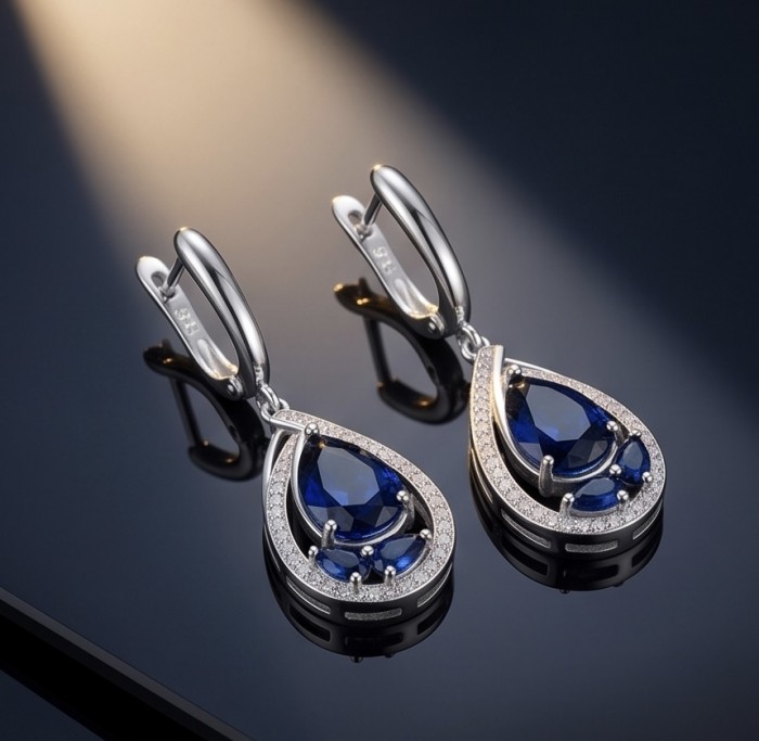 Vintage style - Giovanna - 6.8 carat Sapphire .925 Sterling Silver handcrafted earrings - Teardrop sapphire earrings side view on reflective surface