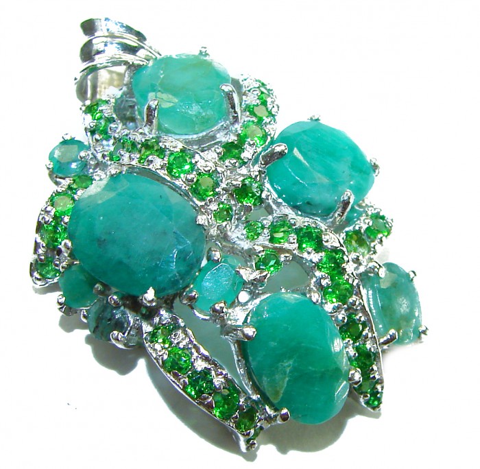 Luxurious 22.6 carat Colombian Emerald .925 Sterling Silver handmade Pendant - Close-up of luxurious emerald and sterling silver jewelry piece.