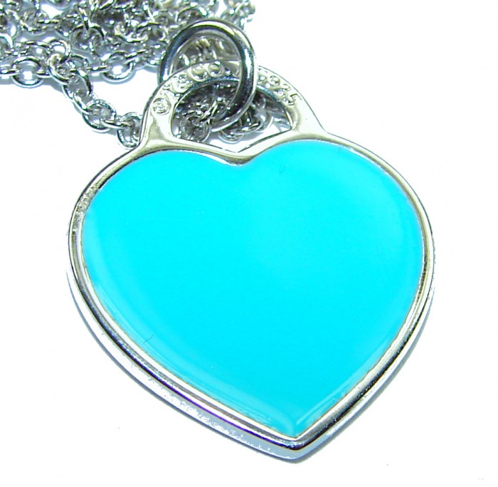 Angel's Heart inlay Turquoise .925 Sterling Silver handcrafted necklace - Close-up of heart-shaped turquoise pendant with silver chain.