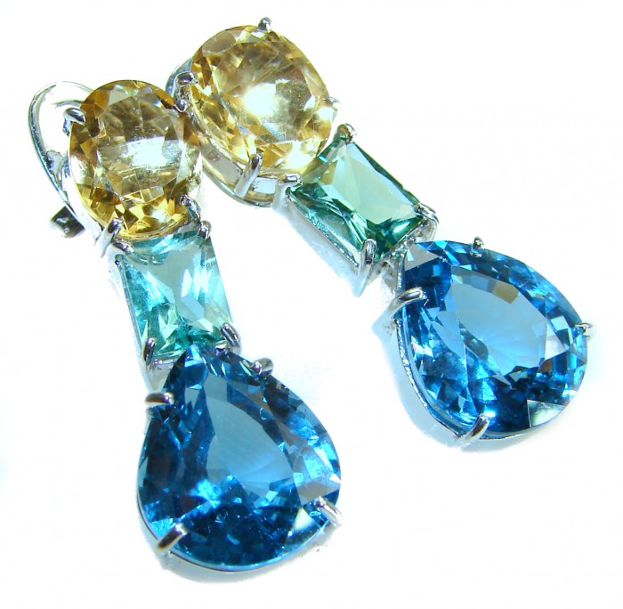 Atlantica 18.7 carat Swiss Blue Topaz .925 Sterling Silver Handcrafted Statement earrings - Dangling earrings with blue topaz and citrine stones, close-up view.