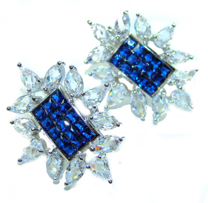 Born to Glam authentic 10.5 carat Sapphire .925 Sterling Silver handcrafted earrings - Close-up of sapphire and sterling earrings on white background