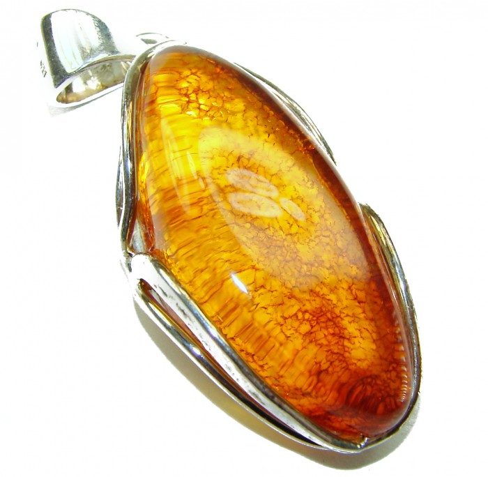 Prehistoric Authentic Baltic Amber .925 Sterling Silver beautifully handcrafted Pendant - Stone close-up of Baltic amber in silver setting.