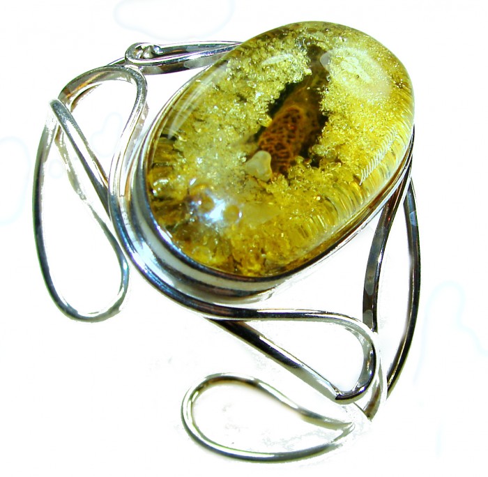 Golden Odyssey Huge Genuine Baltic Amber .925 Sterling Silver handcrafted Bracelet / Cuff - Golden Baltic amber in sterling silver, stone close-up, side view.