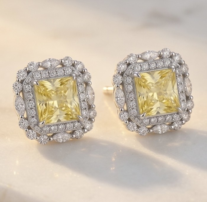 4.5 carat Golden - yellow Montana Sapphire .925 Sterling Silver handcrafted earrings - Yellow Montana sapphire earrings, front view on marble background.