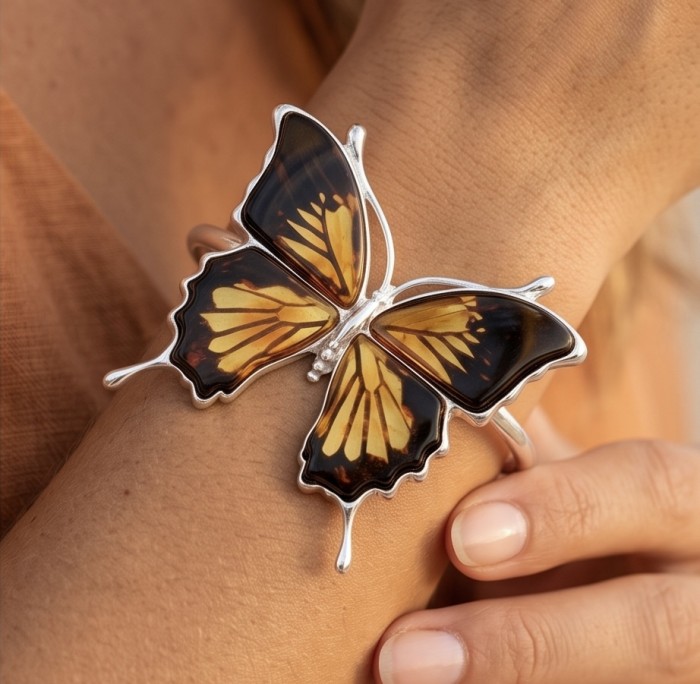 Golden carved Butterfly Genuine Baltic Amber .925 Sterling Silver handamde Bracelet - Butterfly amber cuff bracelet on wrist, close-up view