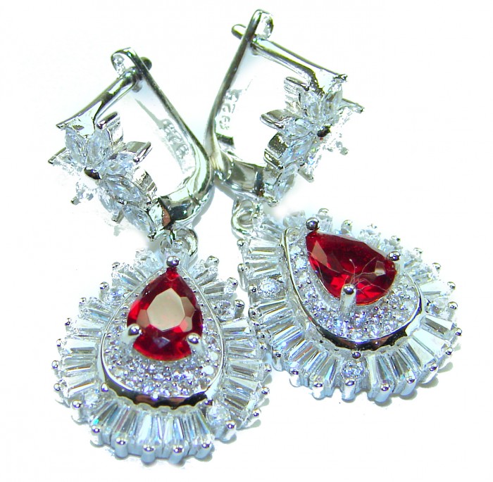 Magnificent Jewel 4.5 carat Ruby .925 Sterling Silver handcrafted incredible earrings - Close-up of ruby and silver earrings with intricate stone detailing