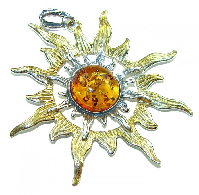 Bright Sun Baltic Polish Amber 14k Gold over .925 Sterling Silver handcrafted Pendant - Sun-shaped pendant with amber center, top view, gold and silver detailing.