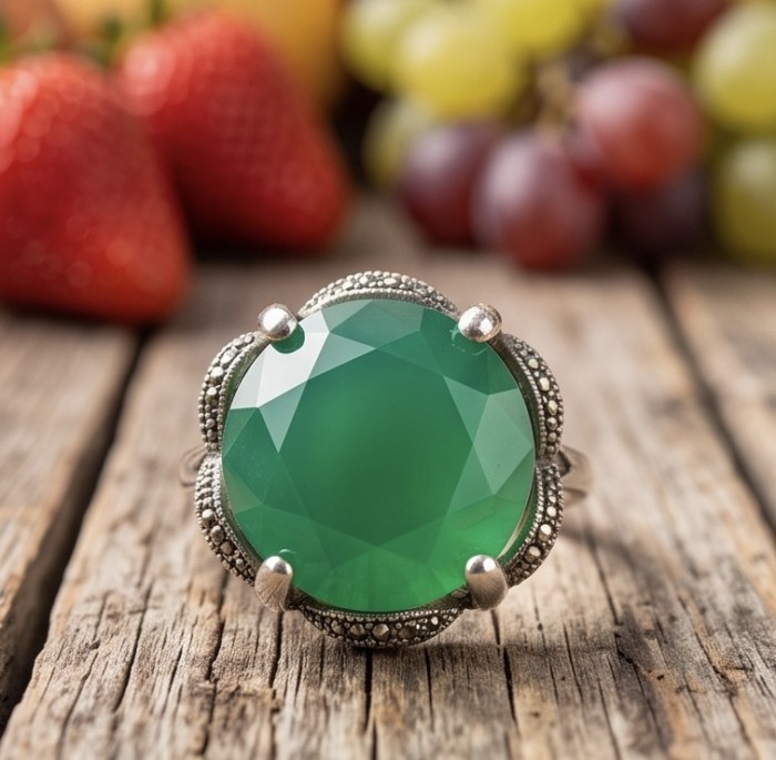 Stella - Very Unique authentic 14.5 carat Jade .925 Sterling Silver handcrafted Ring s. 7 1/4 - Close-up of a jade ring with ornate silver setting on a wooden surface.