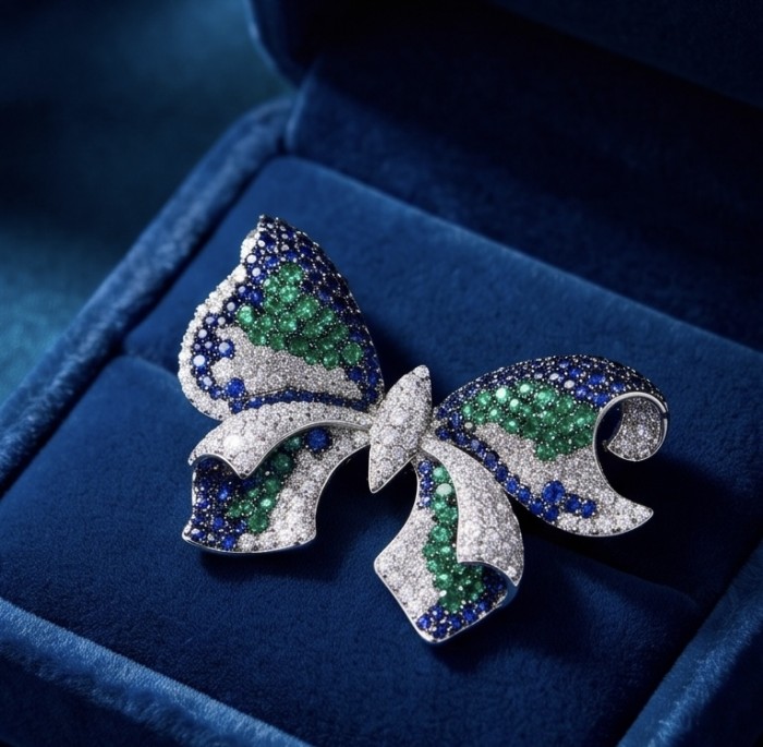 Giovanna - 18.5 carat Authentic Emerald Sapphire .925 Sterling Silver handcrafted Brooch - Butterfly brooch with emeralds and sapphires in a velvet box, top view.