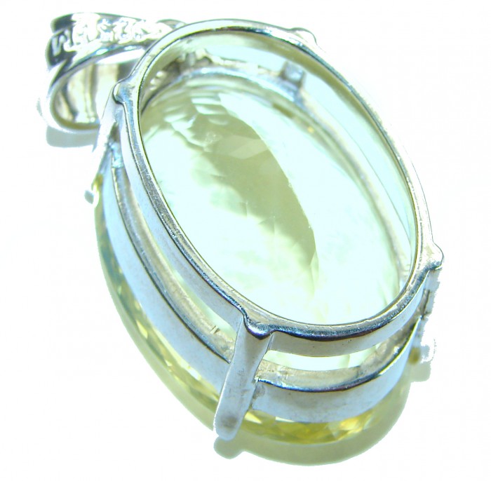 Perfection Oval cut 42.3 carat Lemon Quartz .925 Sterling Silver handcrafted pendant - Side view of oval cut 42.3 carat lemon quartz in .925 sterling silver setting.