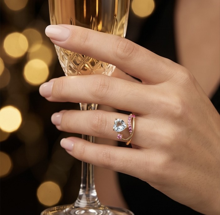Atlantica 4.8 carat Swiss Blue Topaz 18K Gold over .925 Sterling Silver dipped in rhodium handcrafted ring size 8 - Worn on hand: Atlantica 4.8 carat Swiss Blue Topaz ring with champagne glass.