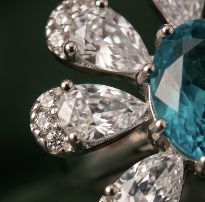 WONDERLAND 3.8 carat Paraiba Tourmaline rhodium over .925 Sterling Silver Handcrafted Ring size 9 - Close-up of Paraiba Tourmaline ring with pear-cut diamonds.