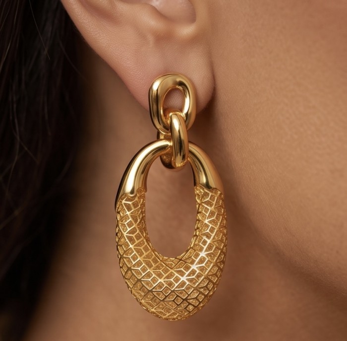 Dubai Style - .925 Sterling Silver dipped in 22K Gold handmade Earrings - Close-up of gold-link earring worn on ear, textured design detail