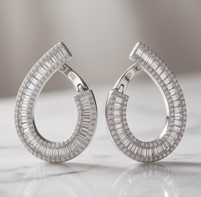 Art Deco Natural 6.5 carat White Topaz rhodium over .925 Sterling Silver handcrafted earrings - Teardrop earrings with white topaz, front view on marble surface.