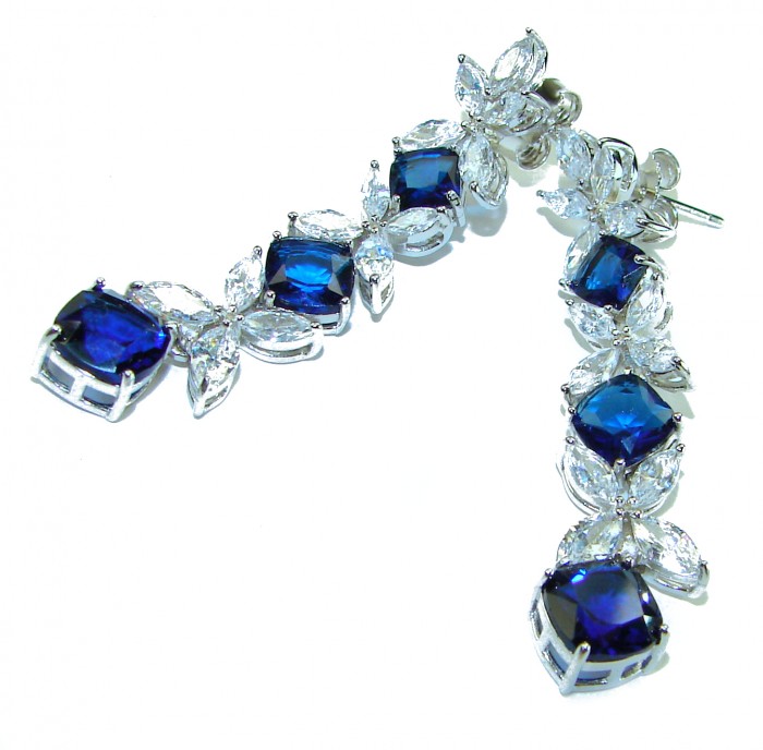 Gabriella 15.2 carat authentic Sapphire rhodium over .925 Sterling Silver handcrafted Statement earrings - Close-up of Gabriella sapphire earrings with clear stones, front view.