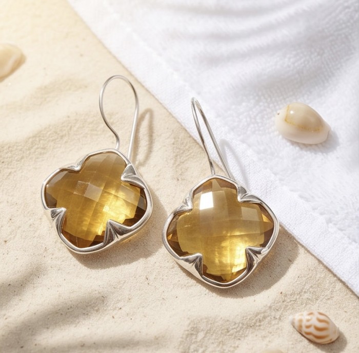 Colden Clover 22.5 carat Champagne Smoky Topaz .925 Sterling Silver handmade Earrings - Close-up of Colden Clover earrings with champagne smoky topaz on sand.