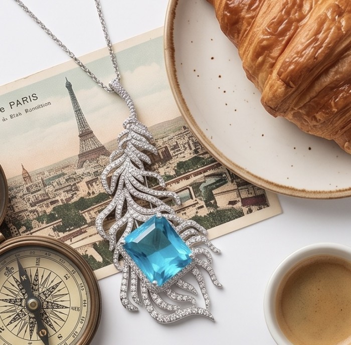 Magic Blue Feather Large 10.8 carat Swiss Blue Topaz .925 Sterling Silver DIPPED IN RHODIUM handmade Brooch - Flat lay of Magic Blue Feather necklace with blue topaz and croissant.