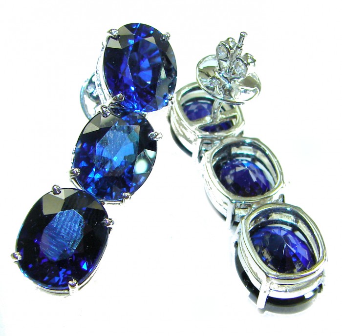 Oceania - Deep Ocean 22.5 carat London Blue Topaz .925 Sterling Silver handmade Statement earrings - Close-up of Oceania earrings with London Blue Topaz stones.
