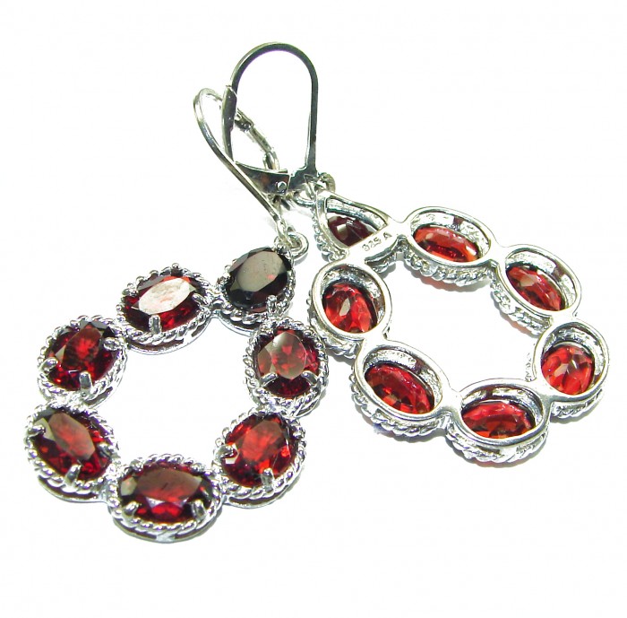 Red Royalty Authentic 22.9 carat Garnet .925 Sterling Silver brilliantly handcrafted earrings - Red garnet earrings in sterling silver, close-up angle highlighting stones.