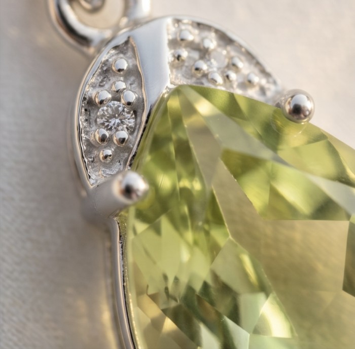 Pear cut 11.3 carat Lemon Quartz rhodium over .925 Sterling Silver handcrafted pendant - Close-up of pear cut Lemon Quartz pendant in sterling silver setting.
