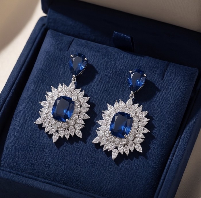 Giuseppina - Authentic 15.5 carat Amethyst Sapphire rhodium over .925 Sterling Silver handcrafted Statement earrings - Close-up of sapphire earrings with diamond accents in a box.