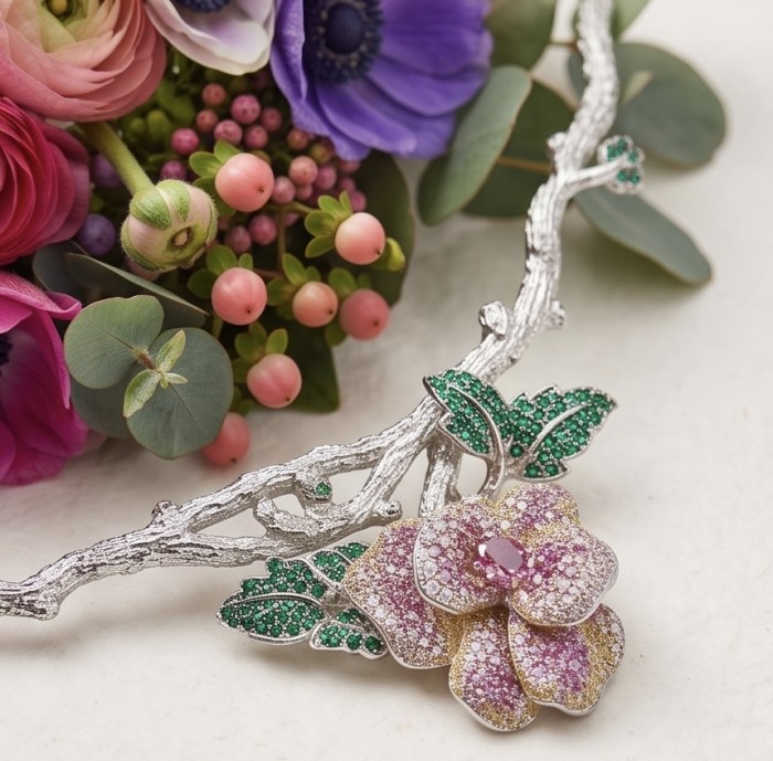Enchanted Rose 5.5 carat pave Pink Sapphire rhodium over .925 Sterling Silver handcrafted necklace - Enchanted Rose necklace with floral detail displayed on floral background.