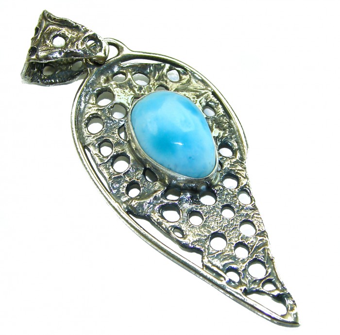 The best quality Natural Larimar from Dominican Republic .925 Sterling Silver handcrafted pendant - Side view of a silver pendant with natural blue Larimar stone.