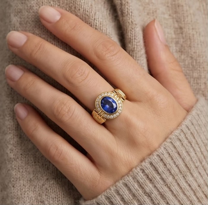 Born to Glam 4.1 carat natural Tanzanite .925 Sterling Silver dipped in 18K Gold Perfectly handcrafted Ring s. 7 - Worn on hand: Tanzanite ring, gold band with diamond accents.