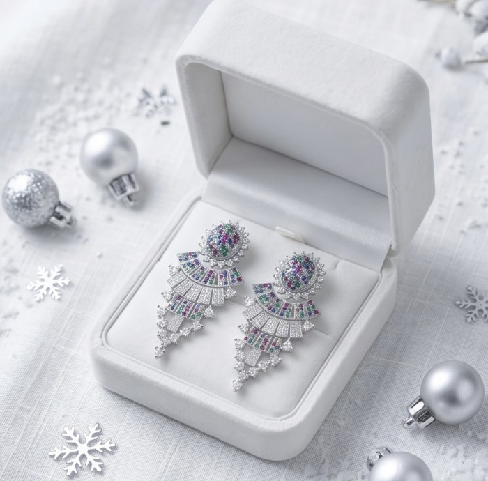 Authentic 10.7 carat Sapphire Ruby Emerald Rhodium over .925 Sterling Silver handcrafted Statement earrings - Earrings in a box with snowflake decor, showcasing stones and design.